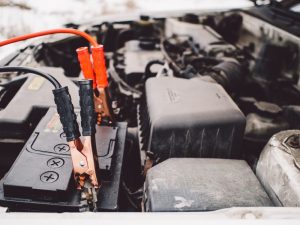 jumper cables and car battery